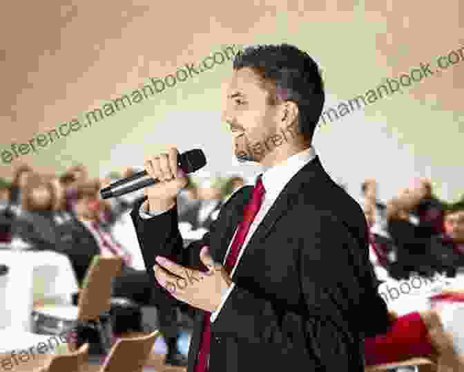 A Black And White Photograph Of Jim Jones Standing In Front Of A Microphone, Speaking To A Large Crowd. He Is Wearing A Dark Suit And Tie, And His Expression Is Intense. Raven: The Untold Story Of The Rev Jim Jones And His People