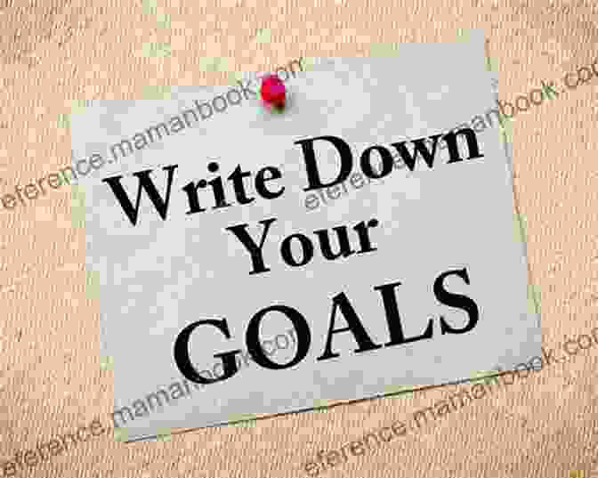 A Person Writing Down Their Financial Goals The Seven Guaranteed Steps To Spiritual Family And Financial Success